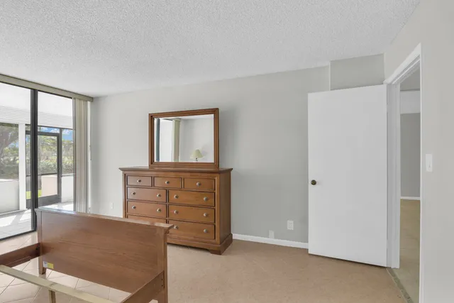 a view of room with furniture and window