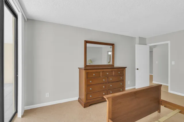 a living room with furniture and mirror