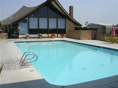 a view of a swimming pool with outdoor seating