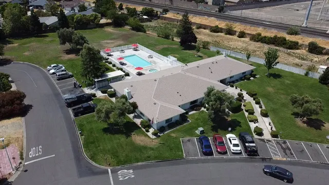 an aerial view of a house with outdoor space