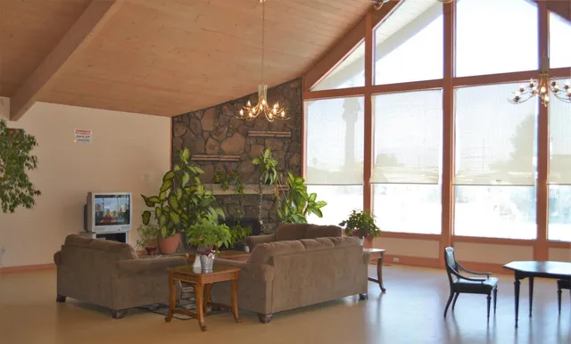a living room with furniture and a window