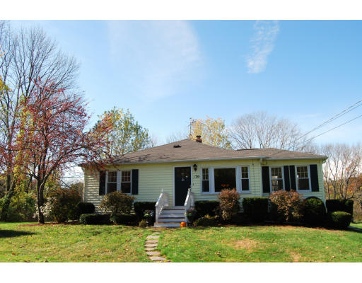 170 Westboro Road Upton, MA 01568 - Photo 1 of 15 a front view of a house with a yard table and chairs
