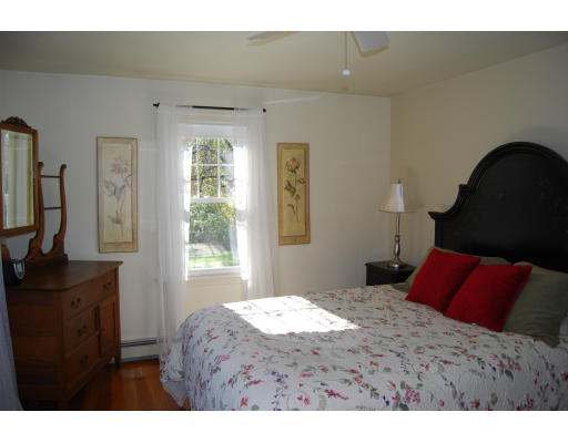 170 Westboro Road Upton, MA 01568 - Photo 11 of 15 a bedroom with a bed and a flat tv screen on dresser