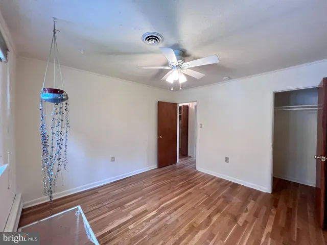 a view of a livingroom with wooden floor