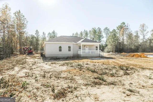 a house with trees in the background