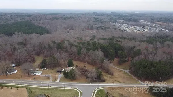 an aerial view of house with yard