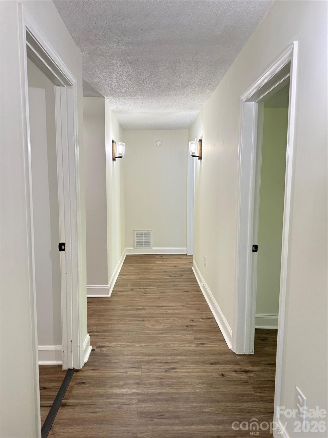 1442 Lee Pearson Road Granite Falls, NC 28630 - Photo 13 of 40 a view of a hallway with wooden floor