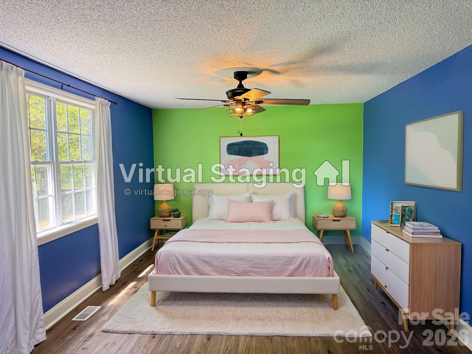 1442 Lee Pearson Road Granite Falls, NC 28630 - Photo 14 of 40 a bedroom with a bed dresser and a window