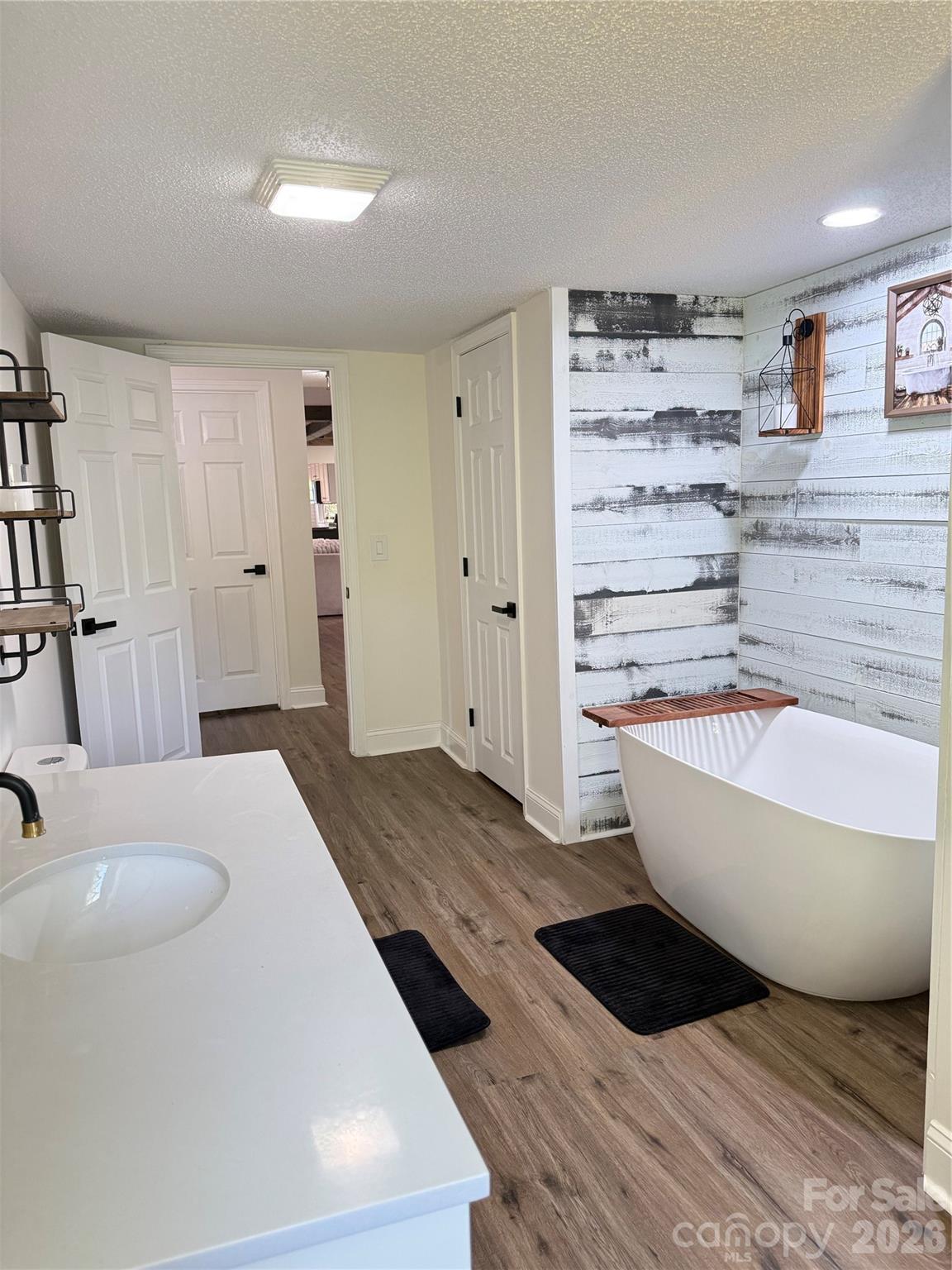 1442 Lee Pearson Road Granite Falls, NC 28630 - Photo 19 of 40 a spacious bathroom with a bathtub and shower
