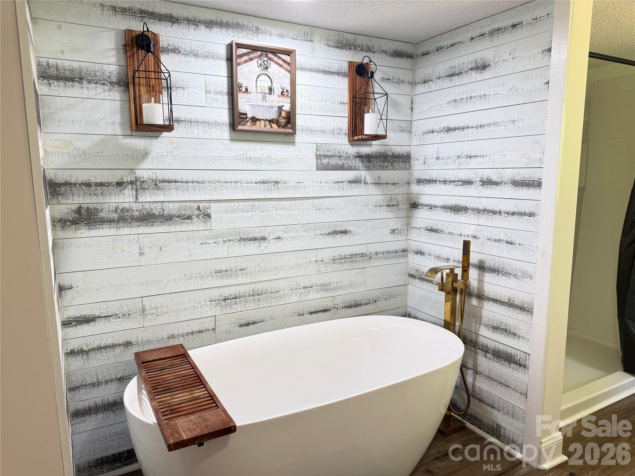 1442 Lee Pearson Road Granite Falls, NC 28630 - Photo 20 of 40 a bathroom with a bathtub and shower