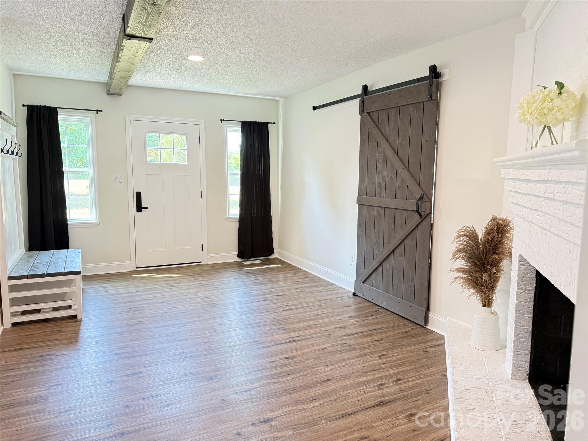 1442 Lee Pearson Road Granite Falls, NC 28630 - Photo 2 of 40 a view of livingroom with hardwood floor and hallway
