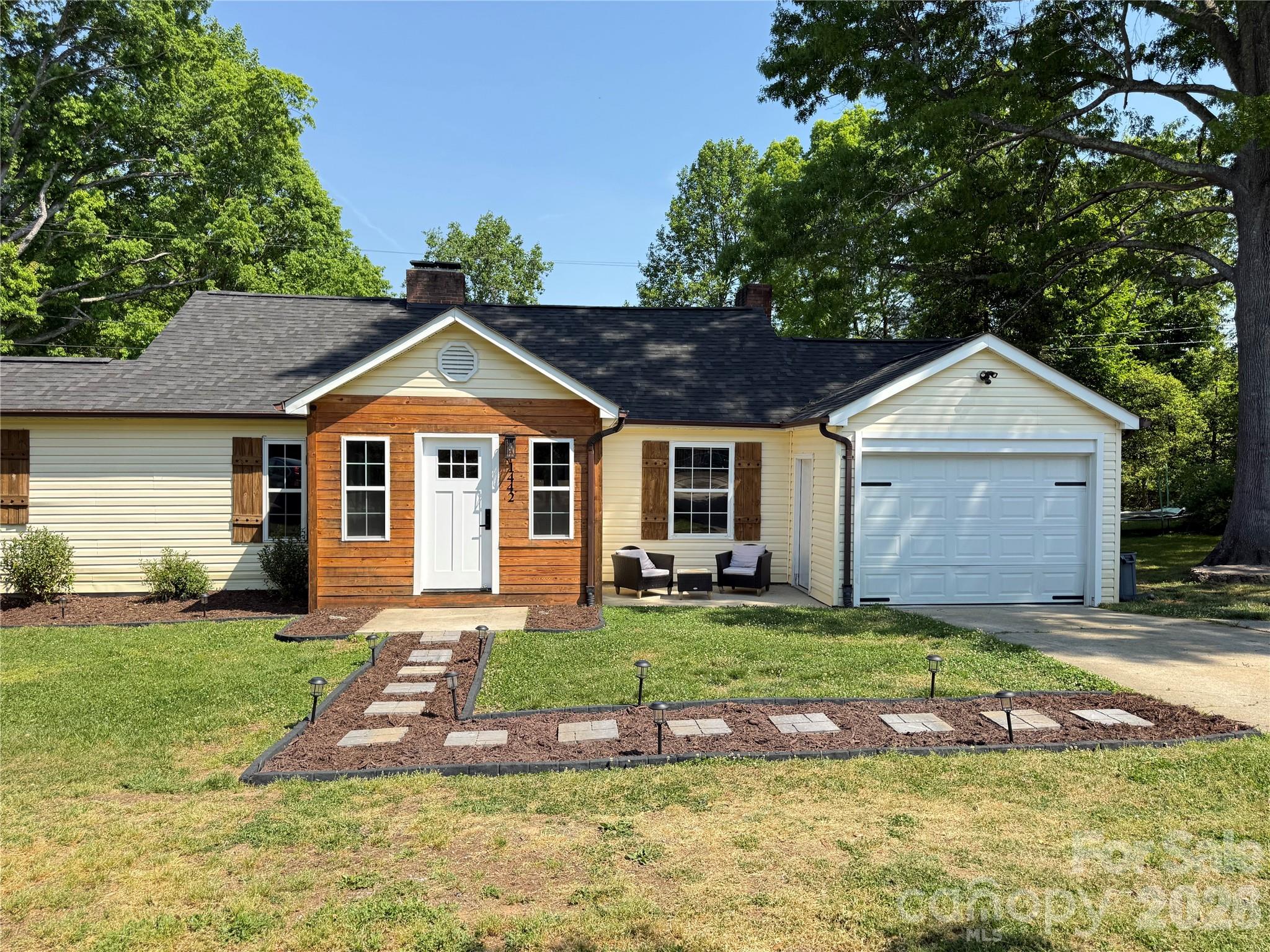 1442 Lee Pearson Road Granite Falls, NC 28630 - Photo 35 of 40 a front view of a house with a yard