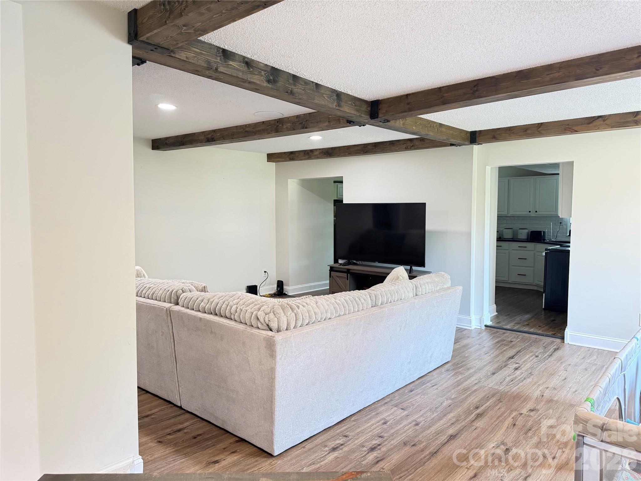 1442 Lee Pearson Road Granite Falls, NC 28630 - Photo 5 of 40 a living room with furniture and a flat screen tv