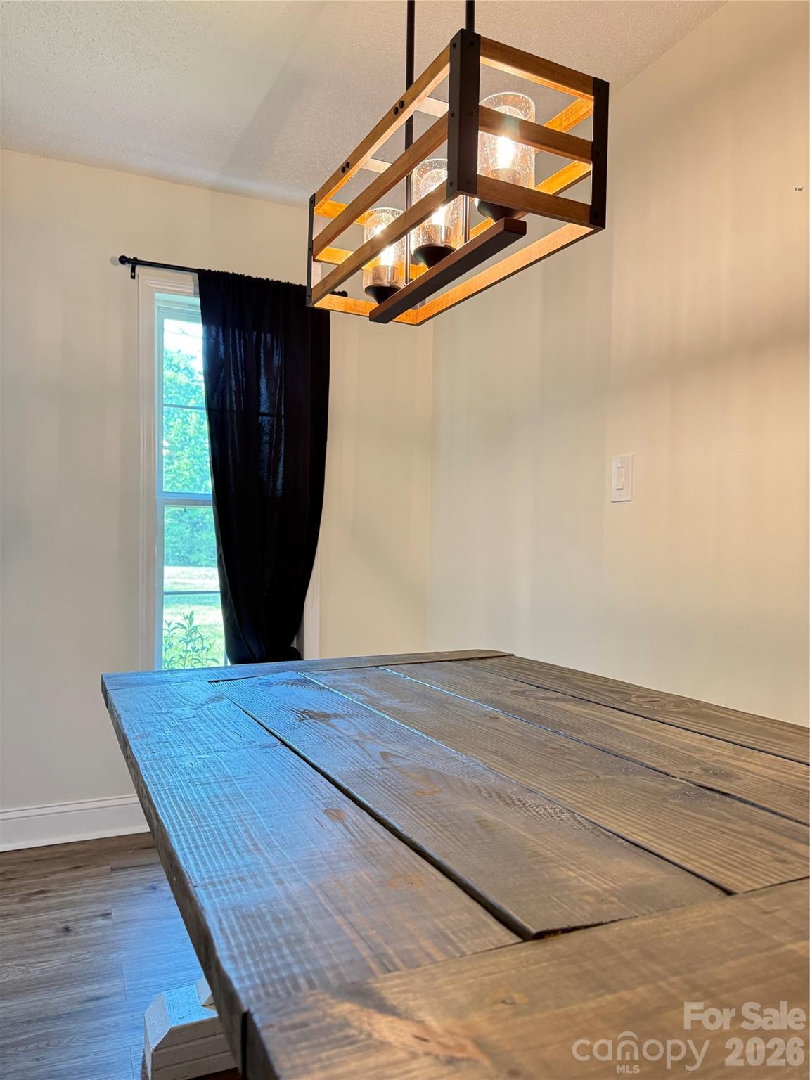 1442 Lee Pearson Road Granite Falls, NC 28630 - Photo 7 of 40 a view of a hallway with wooden floor