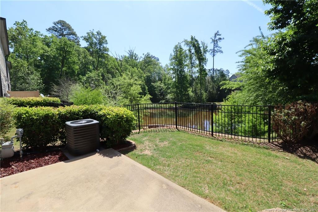 689 Wickham Ridge Road Apex, NC 27539 - Photo 13 of 37 a view of a garden with wooden fence