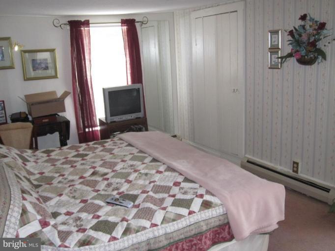 5201 Teeter Road Taneytown, MD 21787 - Photo 13 of 16 a bedroom with a bed and a dresser