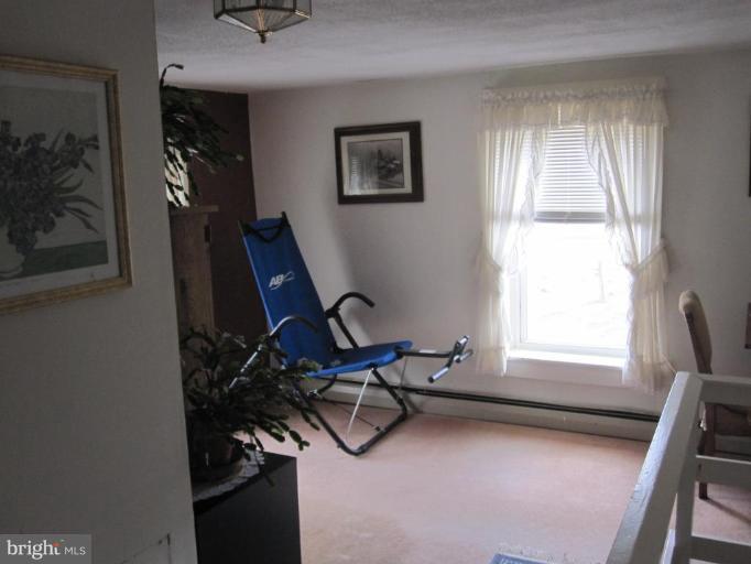 5201 Teeter Road Taneytown, MD 21787 - Photo 15 of 16 a view of a workspace with furniture and a window