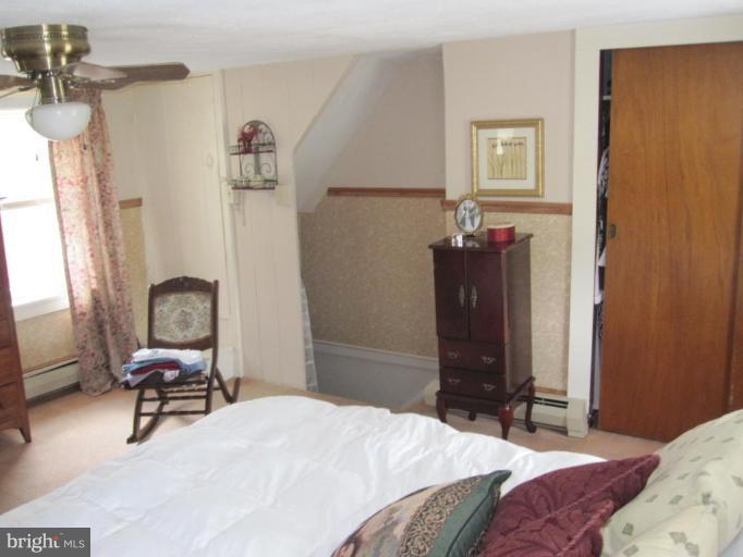 5201 Teeter Road Taneytown, MD 21787 - Photo 16 of 16 a bedroom with a bed and a chair