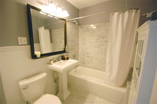 145 Charles Street, Unit 4 Boston, MA 02114 - Photo 11 of 14 a bathroom with a sink toilet and shower