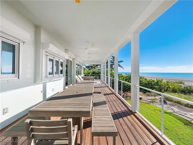 a view of a balcony with chairs