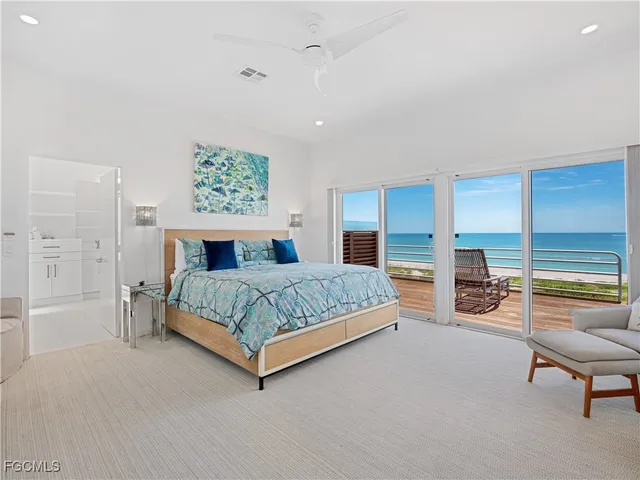 a bedroom with a bed and a lamp with window