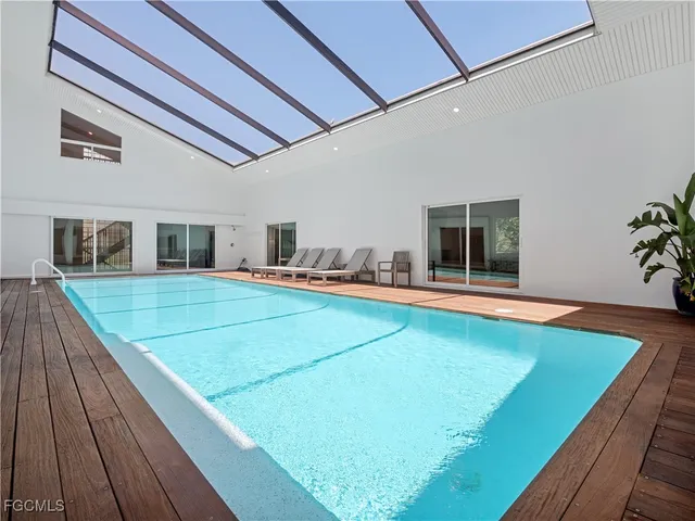 a swimming pool with an outdoor seating