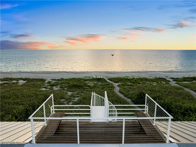 a view of a balcony with ocean view