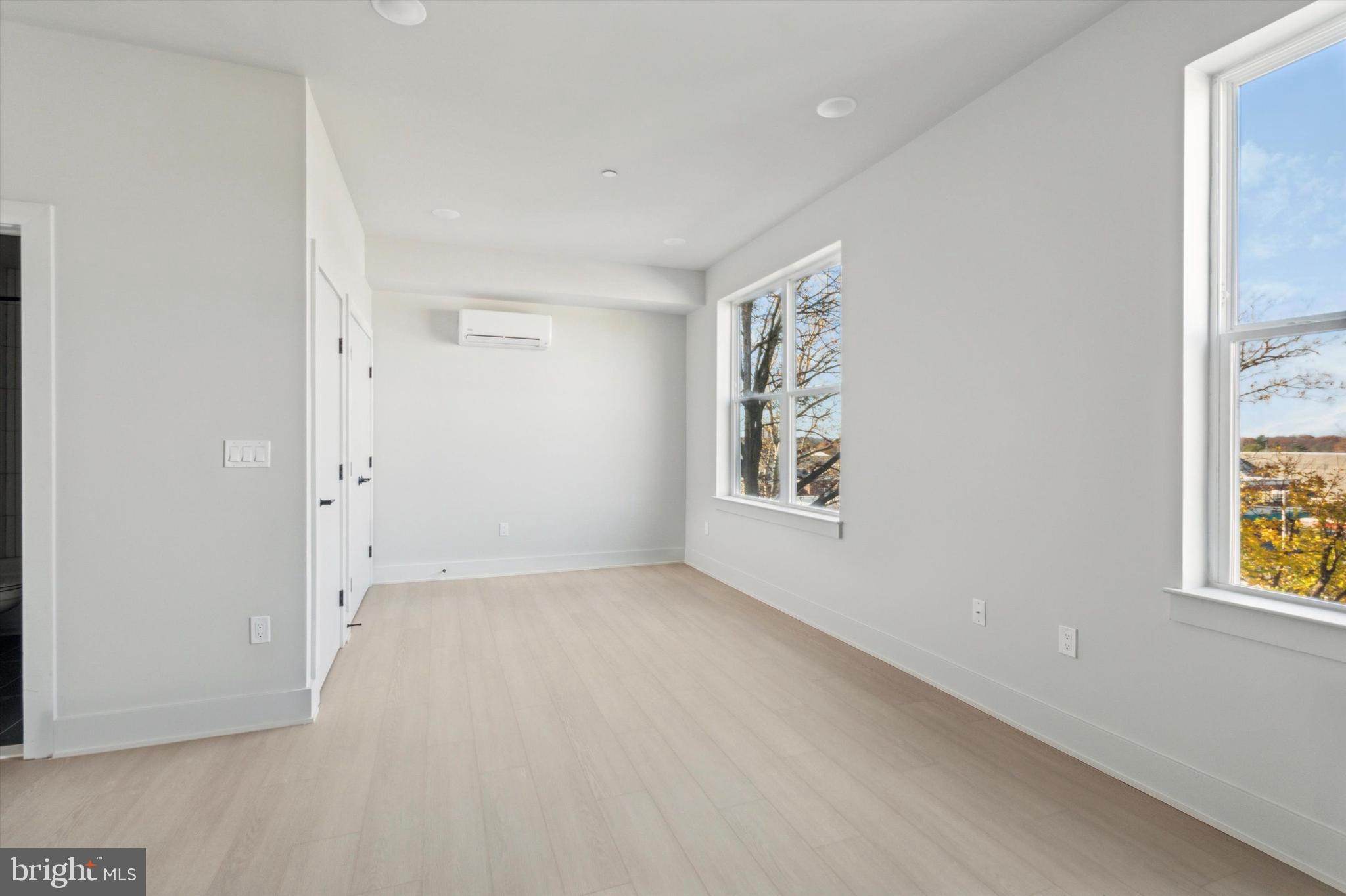5521 Wayne Avenue, Unit 502 Philadelphia, PA 19144 - Photo 12 of 16 an empty room with windows
