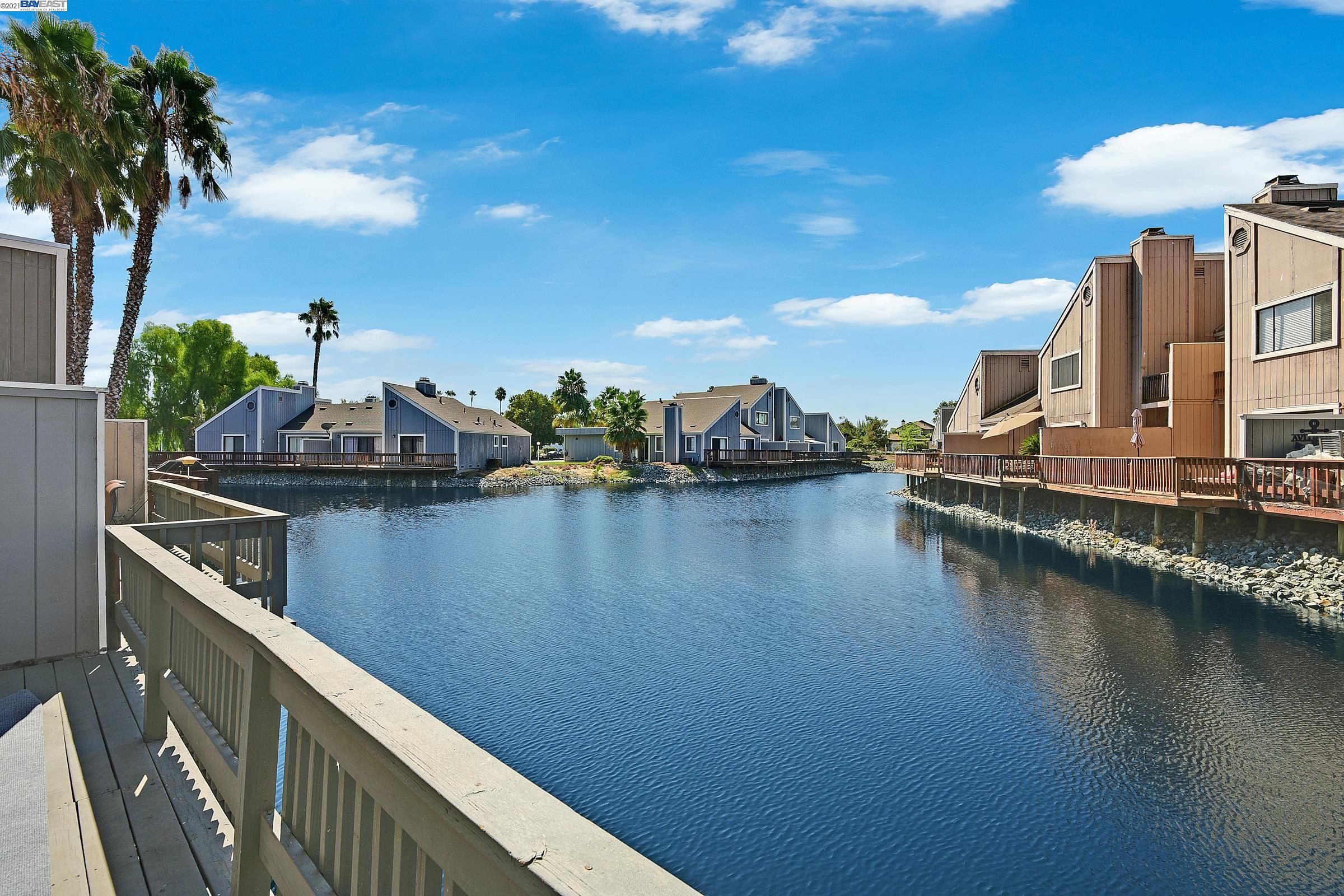 2061 Sand Point Road Discovery Bay, CA 94505 - Photo 1 of 1 a view of a lake with a house