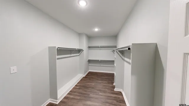 a view of a kitchen from a hallway