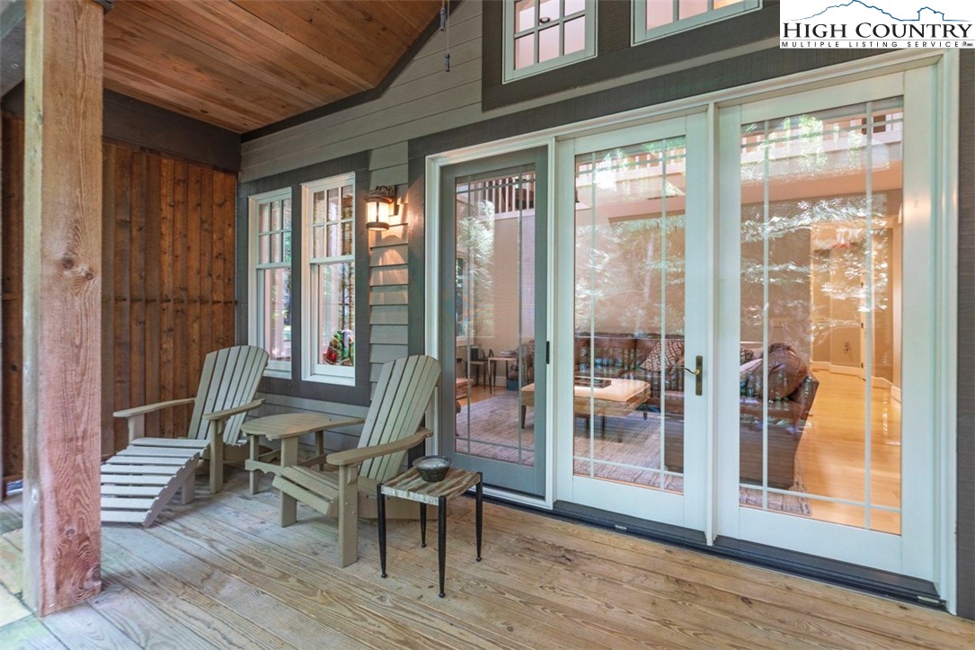 443 Echota Parkway, Unit 9B Boone, NC 28607 - Photo 12 of 43 a living room with furniture and a floor to ceiling window
