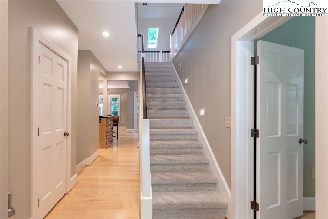 443 Echota Parkway, Unit 9B Boone, NC 28607 - Photo 15 of 43 a view of a hallway with white walls and stairs