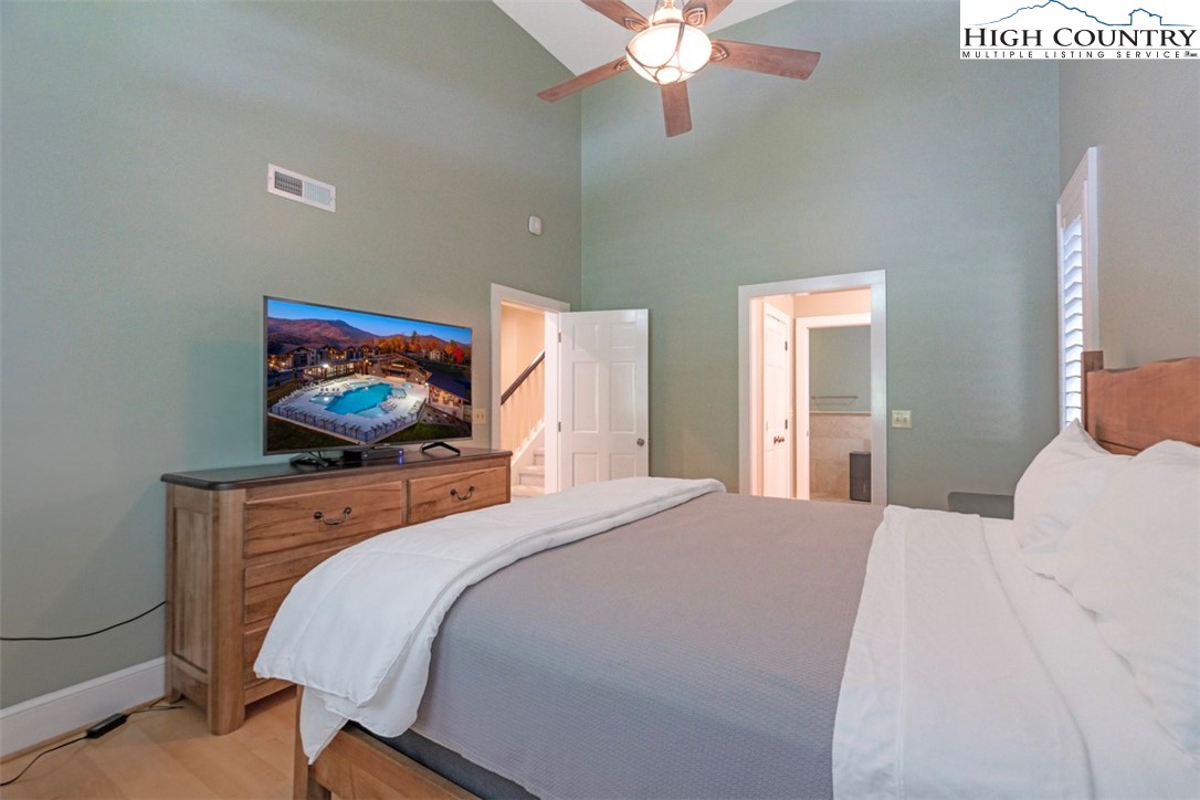 443 Echota Parkway, Unit 9B Boone, NC 28607 - Photo 17 of 43 a bedroom with a bed and a flat screen tv