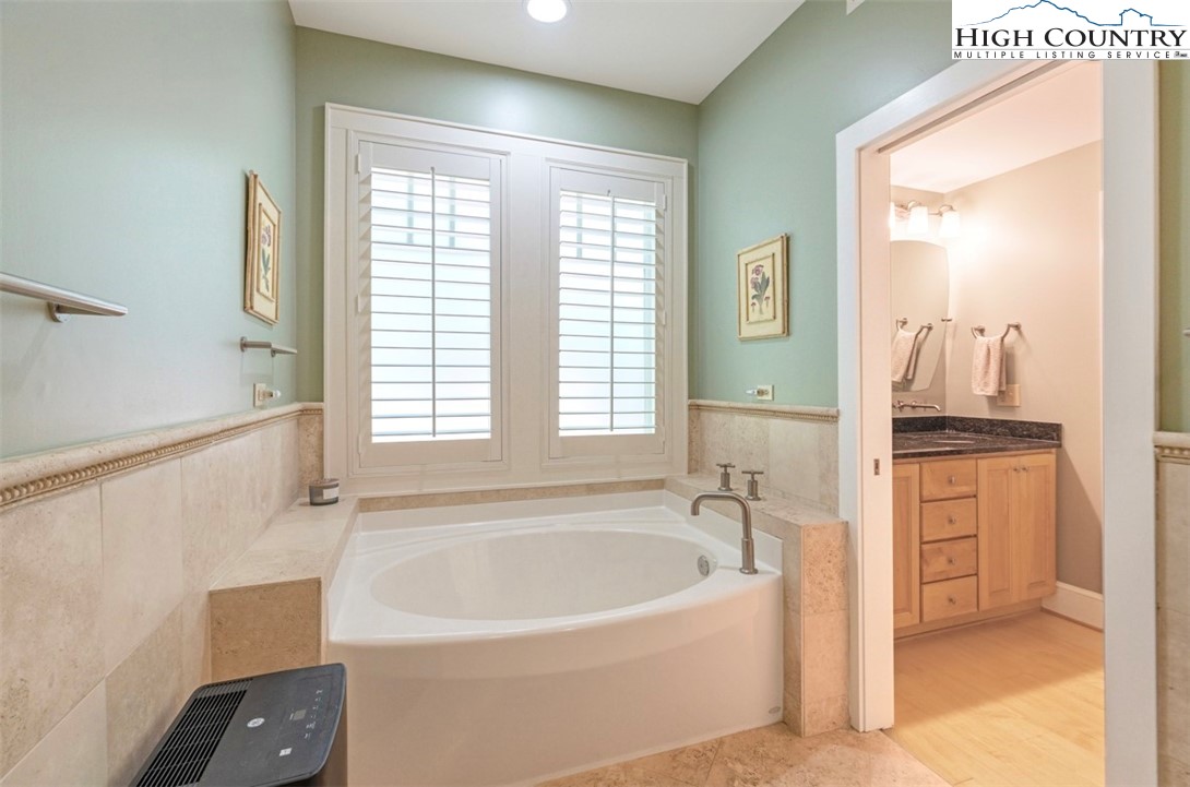 443 Echota Parkway, Unit 9B Boone, NC 28607 - Photo 20 of 43 a white bath tub sitting next to a window