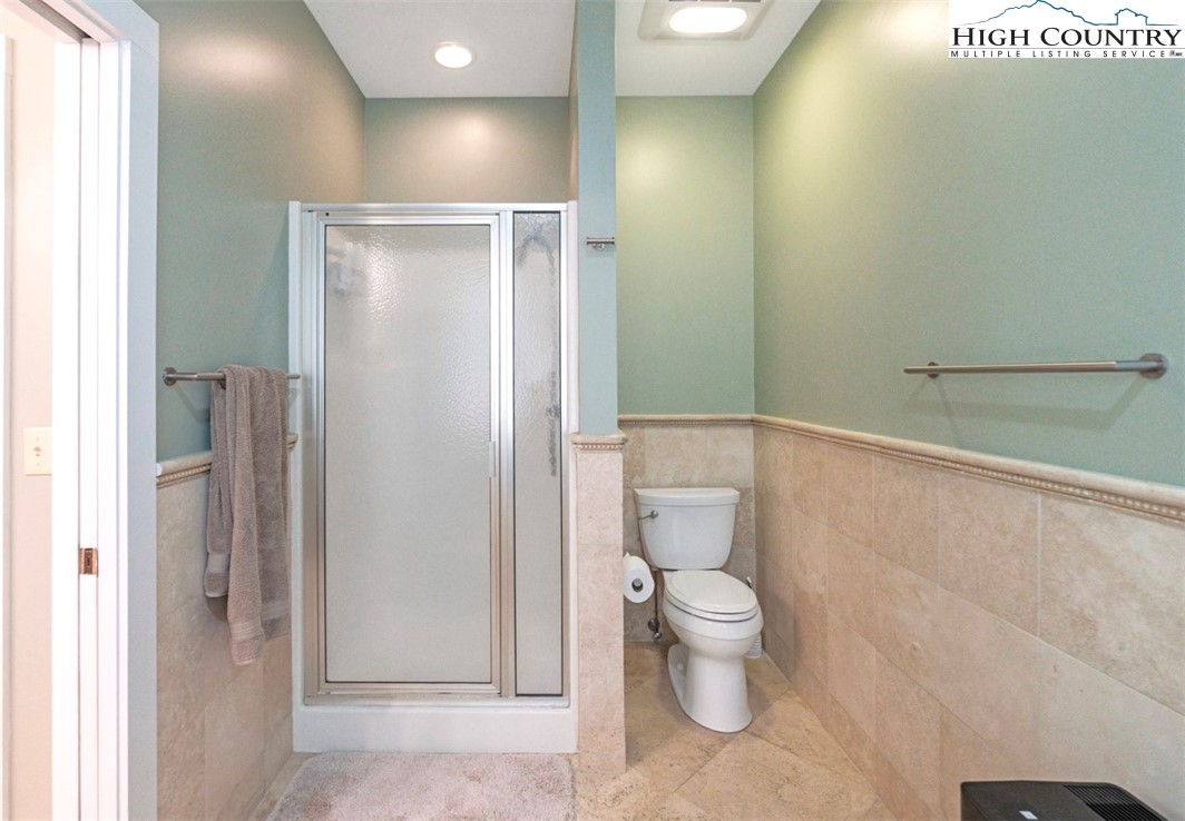 443 Echota Parkway, Unit 9B Boone, NC 28607 - Photo 21 of 43 a bathroom with a toilet and a shower