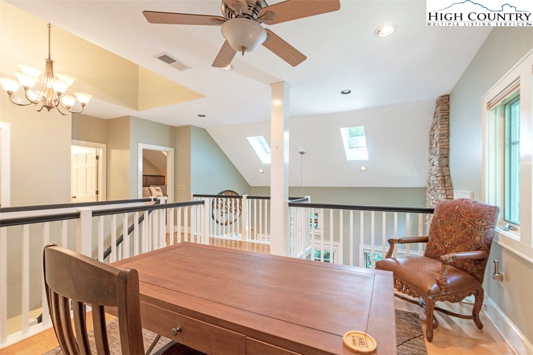 443 Echota Parkway, Unit 9B Boone, NC 28607 - Photo 22 of 43 a view of a dining room with furniture and a chandelier