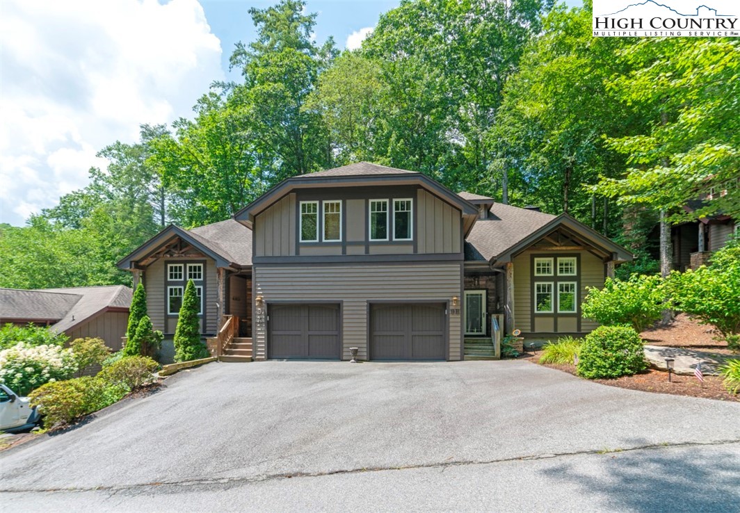 443 Echota Parkway, Unit 9B Boone, NC 28607 - Photo 32 of 43 a front view of a house with a garden