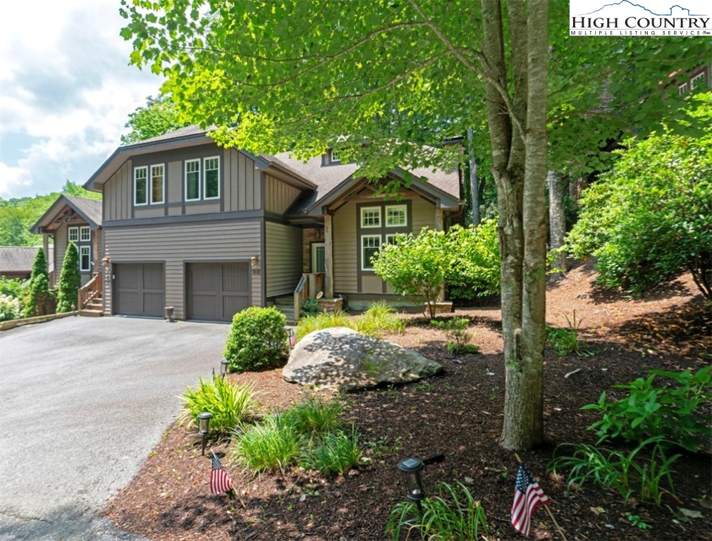 443 Echota Parkway, Unit 9B Boone, NC 28607 - Photo 33 of 43 a front view of a house with a yard and garage