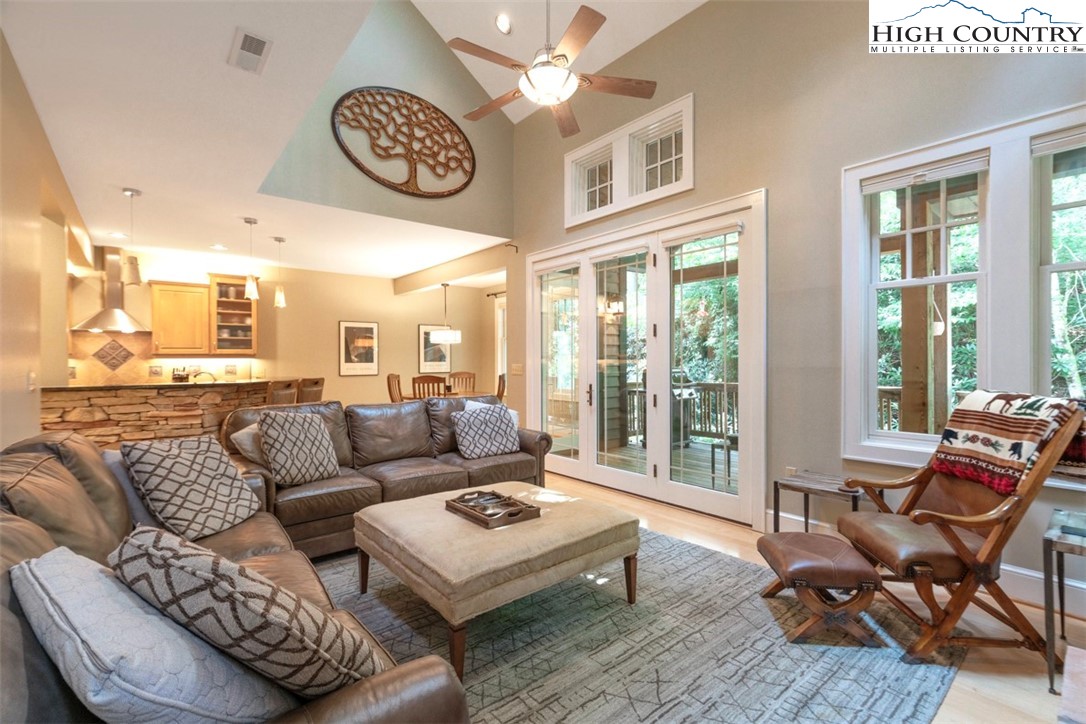 443 Echota Parkway, Unit 9B Boone, NC 28607 - Photo 4 of 43 a living room with furniture and a large window