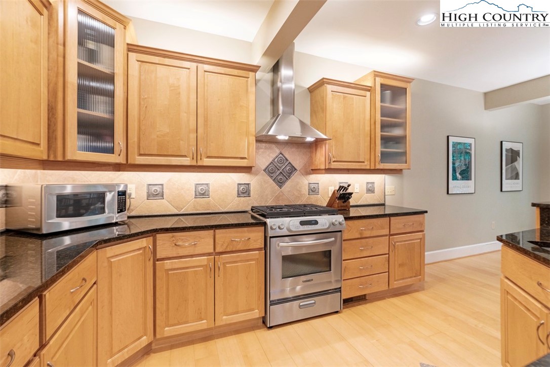 443 Echota Parkway, Unit 9B Boone, NC 28607 - Photo 7 of 43 a kitchen with stainless steel appliances granite countertop a stove and a sink