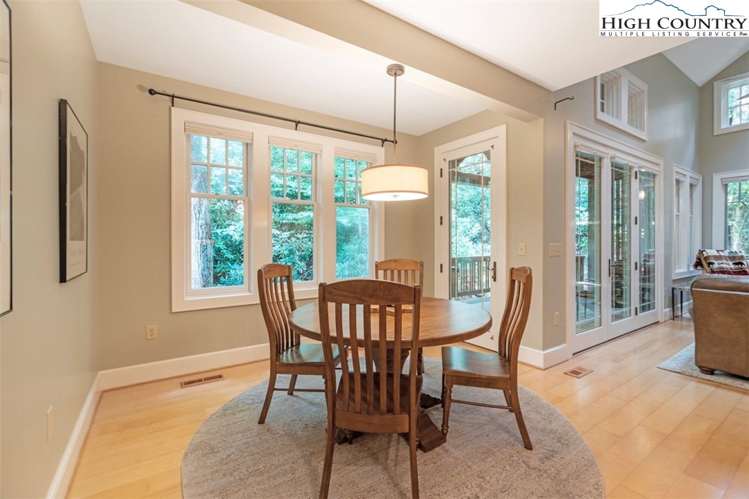 443 Echota Parkway, Unit 9B Boone, NC 28607 - Photo 10 of 43 a view of a dining room with furniture window and outside view