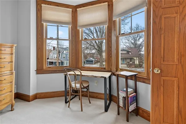 a view of a livingroom with furniture and a window
