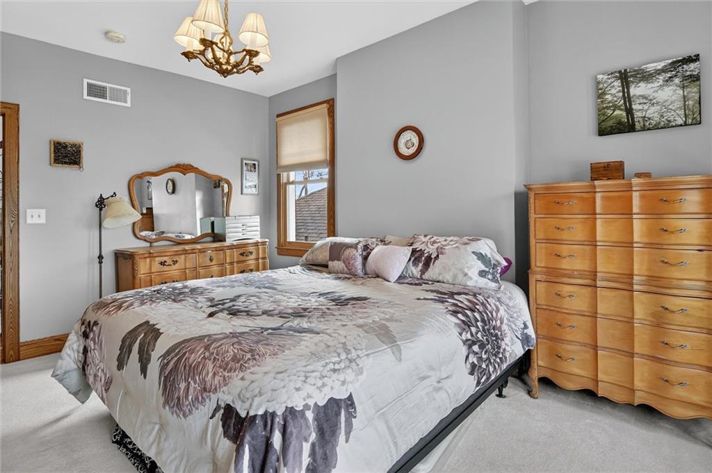 198 Dewey Street Pittsburgh, PA 15218 - Photo 24 of 45 a bedroom with a bed and a window