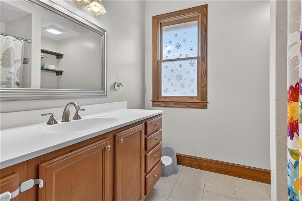 198 Dewey Street Pittsburgh, PA 15218 - Photo 27 of 45 a bathroom with a sink and a mirror