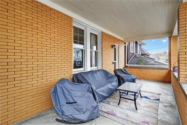 a living room with furniture and a gate