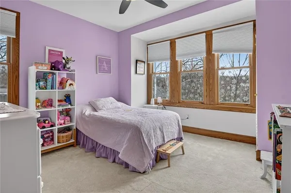 a bed room with a bed and a window