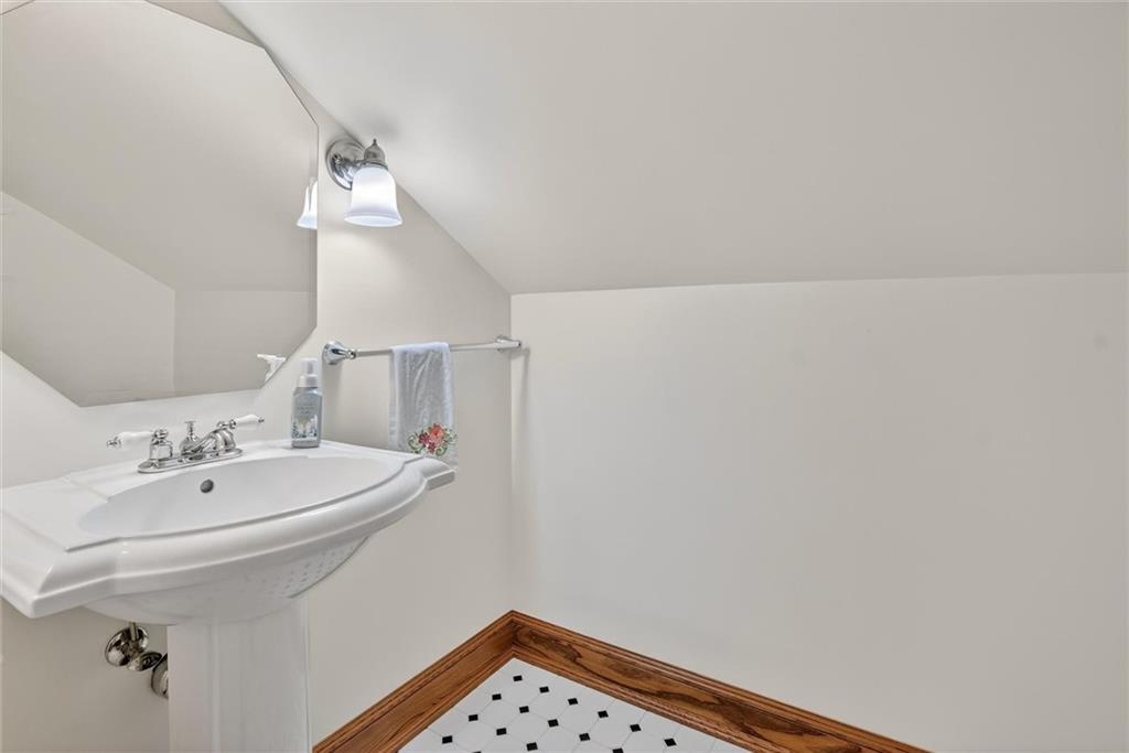 198 Dewey Street Pittsburgh, PA 15218 - Photo 40 of 45 a bathroom with a sink and a mirror