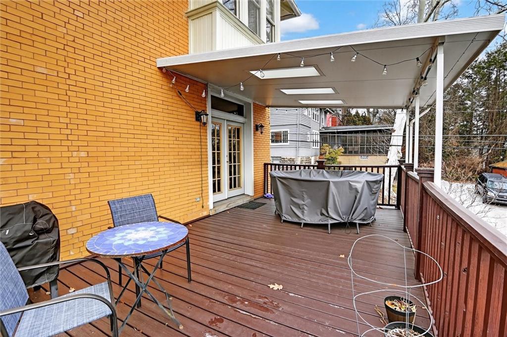 198 Dewey Street Pittsburgh, PA 15218 - Photo 43 of 45 a roof deck with table and chairs
