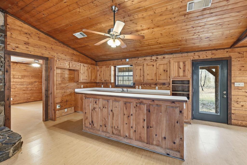 504 Windsor Lane Springtown, TX 76082 - Photo 11 of 40 a bathroom with a sink a mirror and a shower