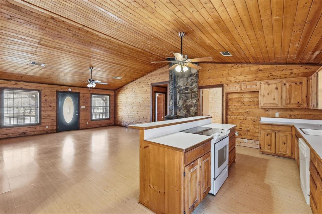 504 Windsor Lane Springtown, TX 76082 - Photo 16 of 40 a kitchen with stainless steel appliances granite countertop a stove and a sink